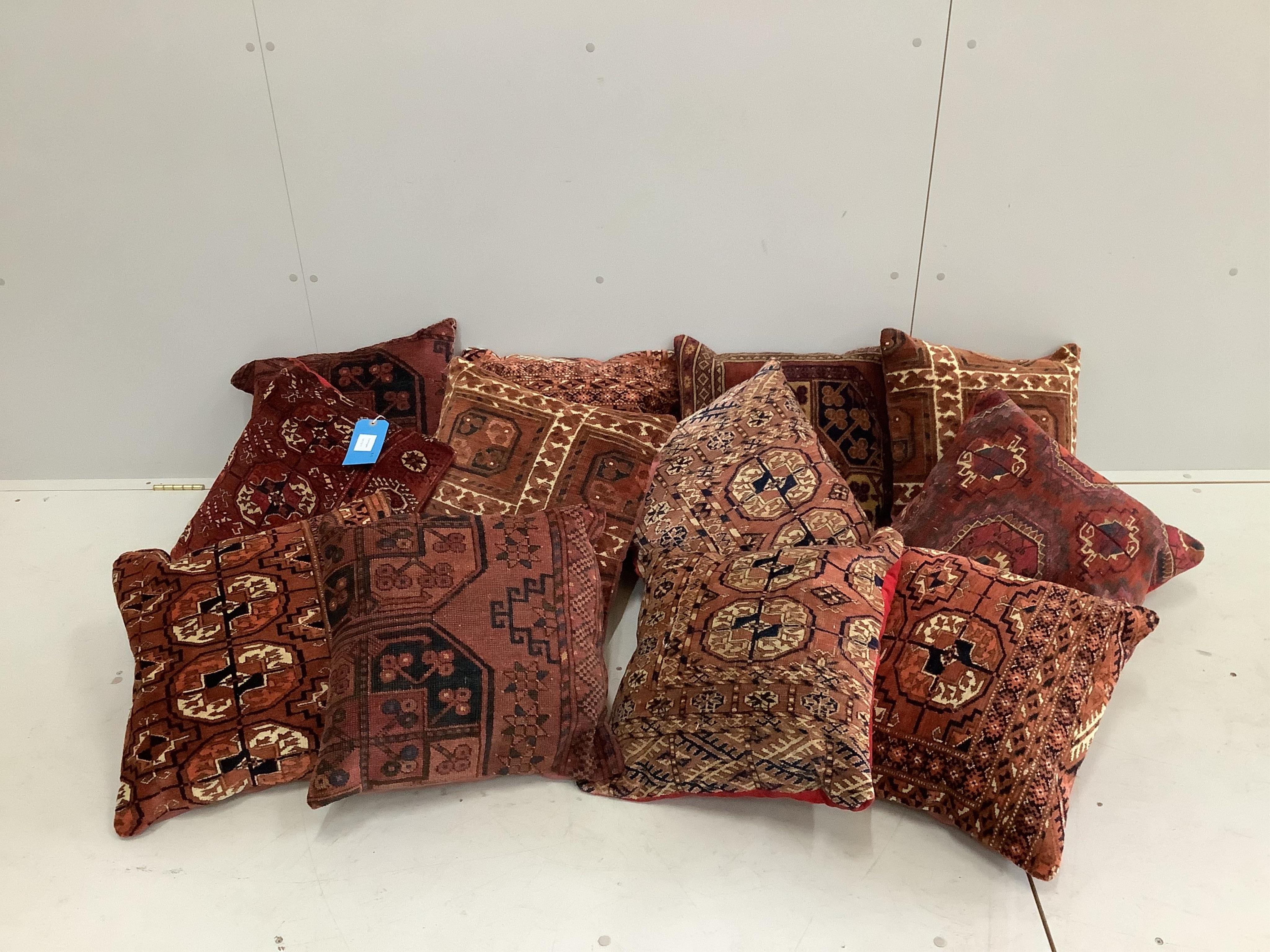 Twelve Tekke and Bokhara cushions, largest 46 x 46cm. Condition - good